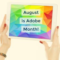 Two hands holding up an iPad with "August is Adobe Month" displayed on screen.