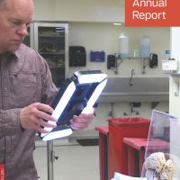 FY2024 Annual Report cover featuring Instructional Technologies Manager Rob Dietz taking images of a brain from the Anatomy lab to compile a 3D image.