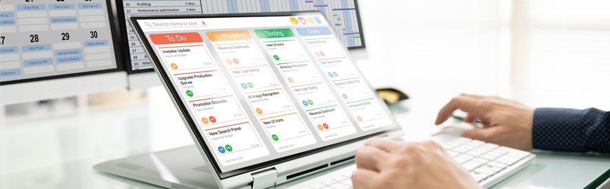 A laptop displaying project management software