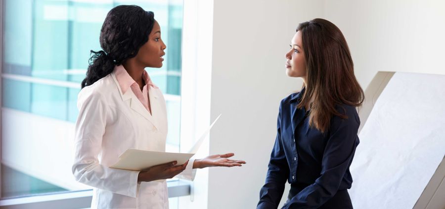 Physician speaking with a patient
