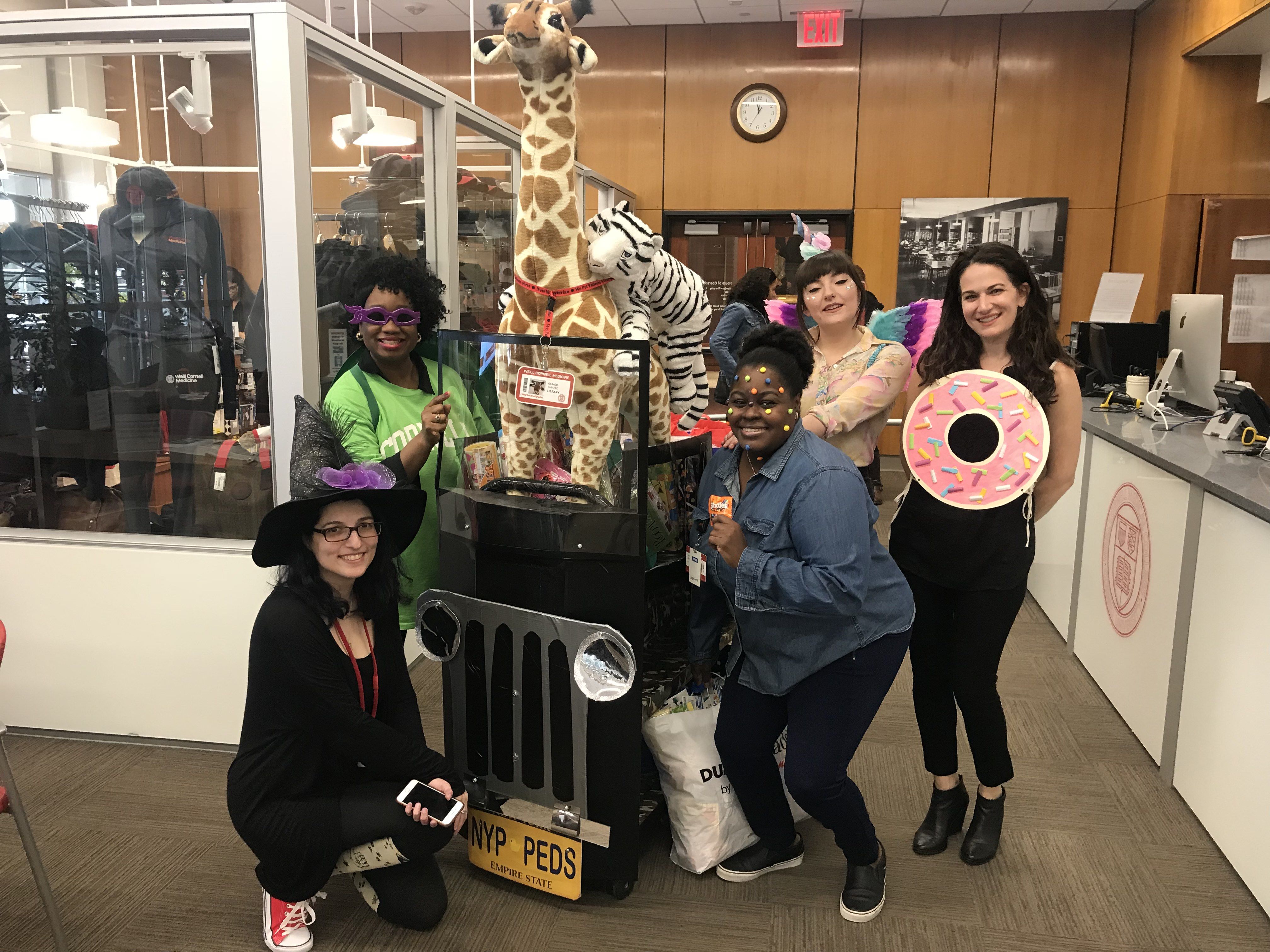 Sherisse Brown and several Library employees dressed up in Halloween costumes to bring treats to patients in the Komansky Children's Hospital.