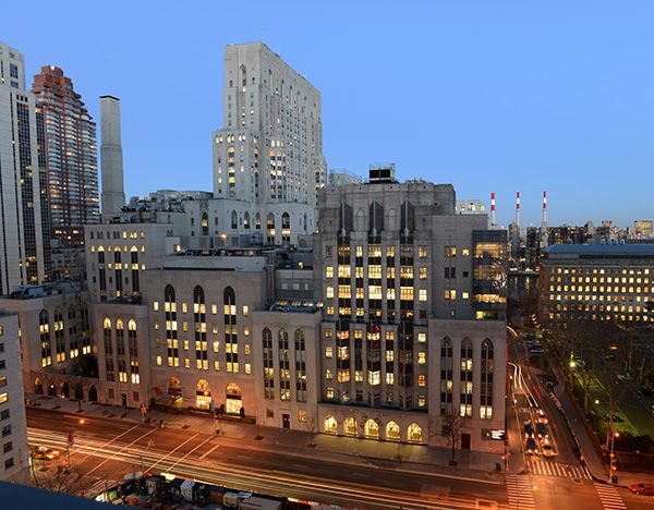 Exterior view of the Weill Cornell Medicine campus at night.