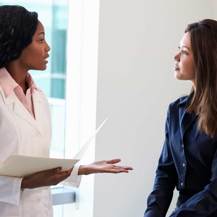 Physician speaking with a patient